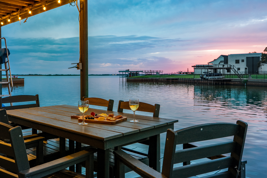 Private dock dining table with lake views at twilight