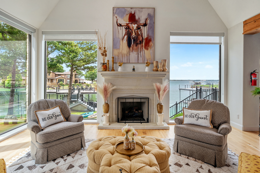 Fireplace seating with views toward the private dock and lake