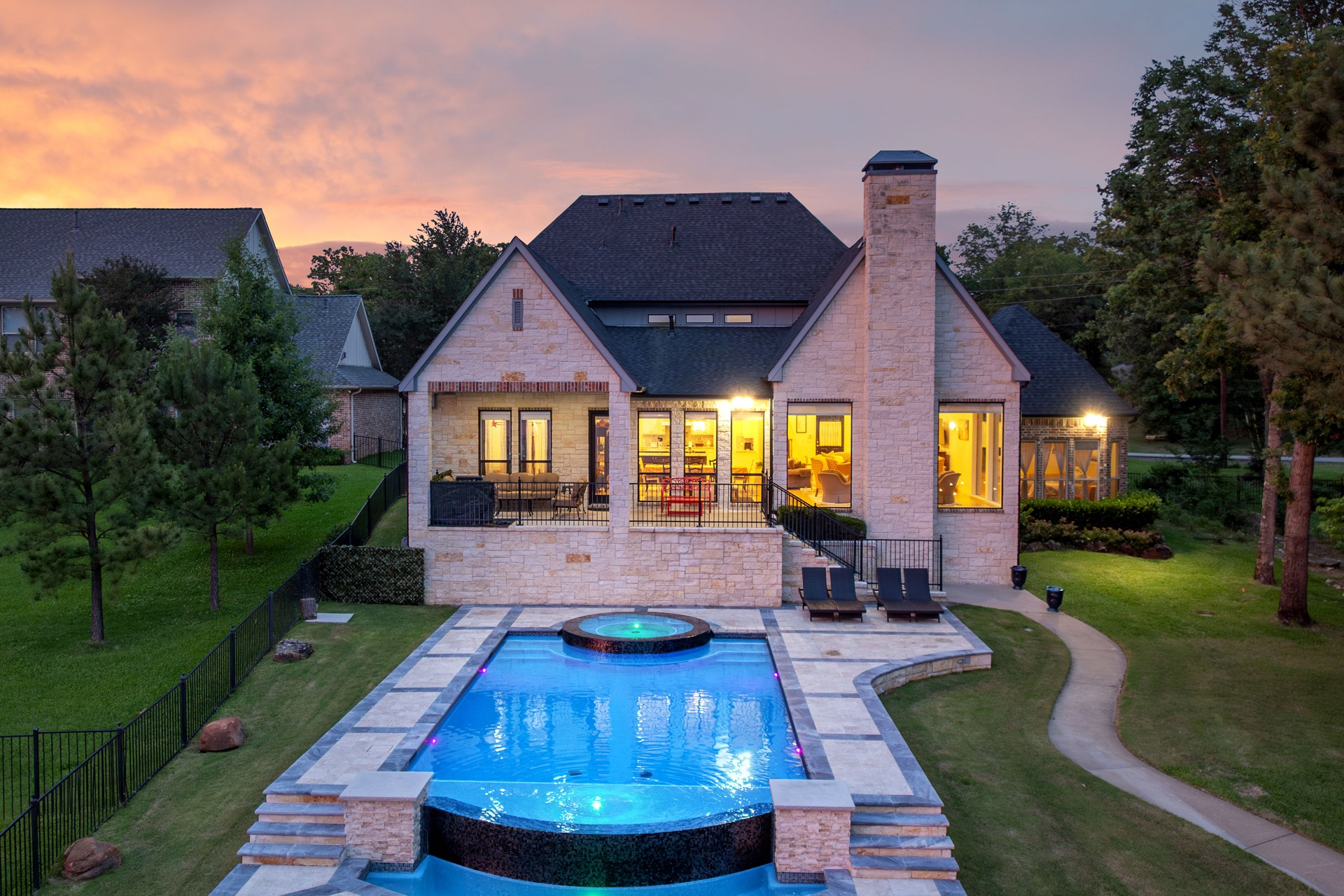 Villa and pool lit up at night