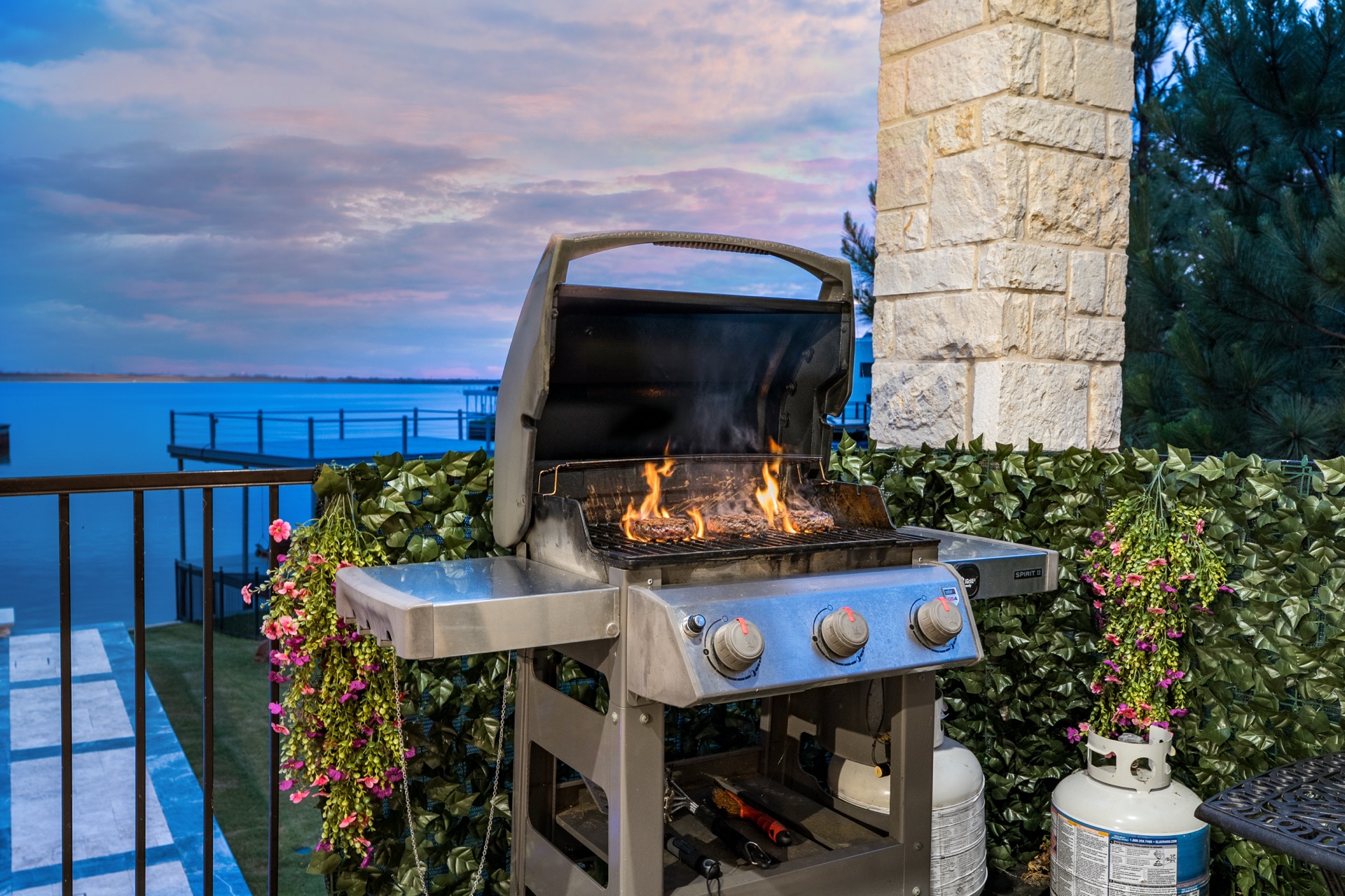 Outdoor grill area with lake view