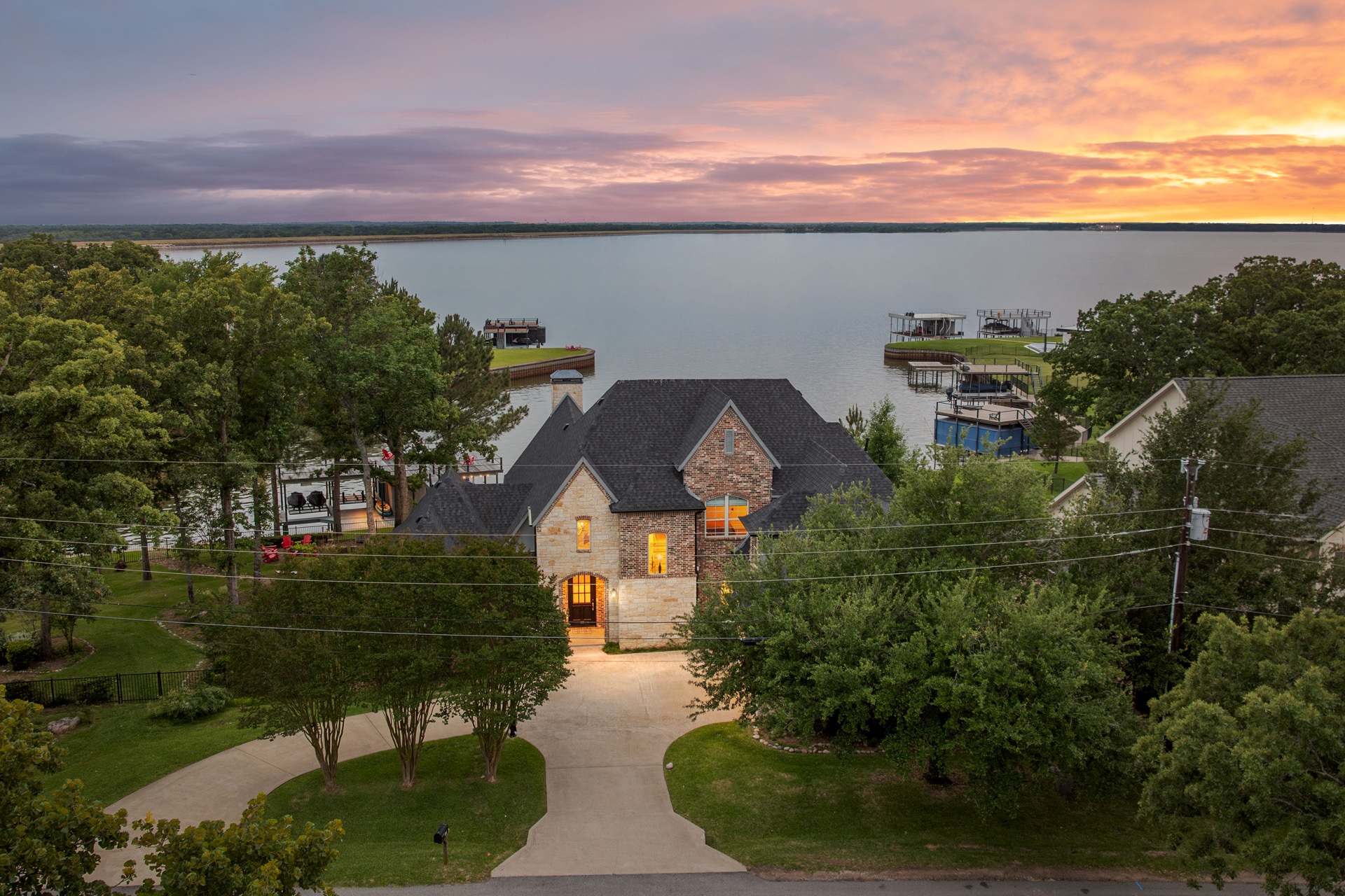 Aerial sunset view of the lakefront villa